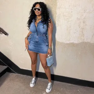Stylish denim sleeveless mini dress with zip front and drawstring waist on model