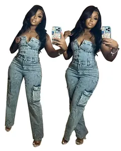 Detail of embroidered cross patches on denim strapless jumpsuit with cargo pockets