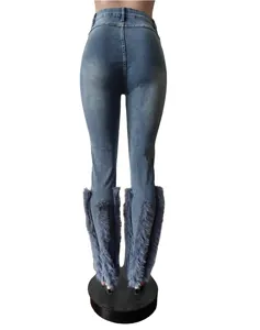 Back view of high elastic blue denim jeans featuring grey faux fur trim at the ankles.