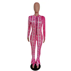 Detail of pink tie-dye slim fit jumpsuit featuring a flared fishtail leg design