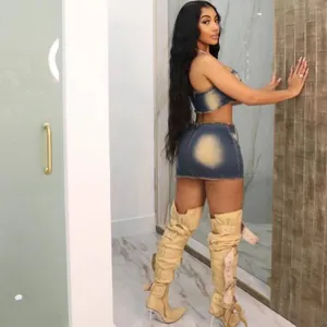 Full view of stylish two-piece denim set with distressed tube top and mini skirt for women