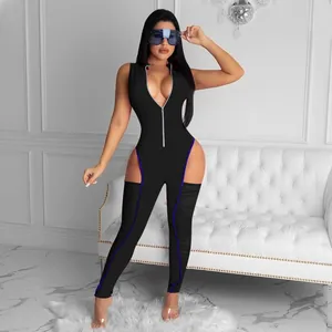 Detail view of a black sleeveless cut-out jumpsuit with slimming fit and blue accents