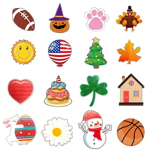 Collection of various holiday-themed wooden charms for interchangeable door signs