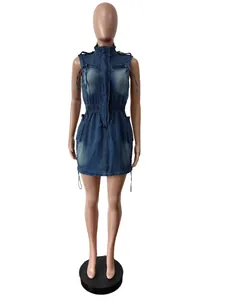 Detail view of a sleeveless slim-fit denim dress with drawstring waist and front pockets