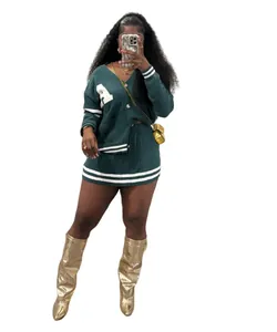Full view of women's dark green varsity style knit cardigan and pleated mini skirt set.