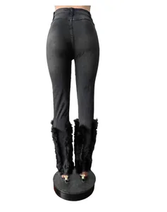 Close-up back view of high stretch distressed denim jeans with black feather hem detail