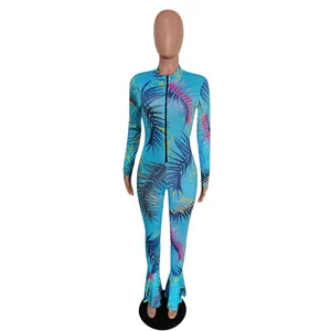 Front view of a slim-fit jumpsuit featuring tropical leaf prints and fishtail hem.