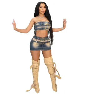 Front view of denim tube top and mini skirt set with oversized belt buckles