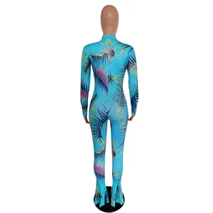 Back view of slim fit tropical print mermaid jumpsuit with palm leaf and chain pattern