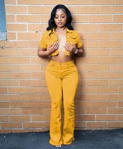 Trendy yellow short sleeve denim crop top and matching flare leg jeans set for women