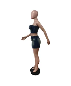Side profile of a trendy two-piece denim set featuring a tube top and mini skirt