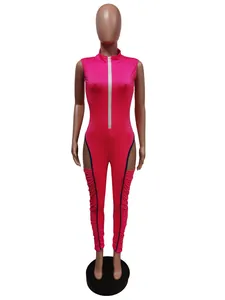 Detailed view of the textured ruching and side cutouts on this stylish pink jumpsuit