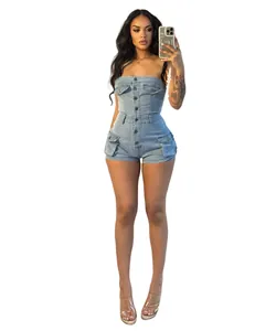 Detail view of a strapless denim bodycon romper with front buttons and pockets.