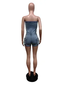 Back detail view of a blue denim tube top jumpsuit with pockets on a mannequin