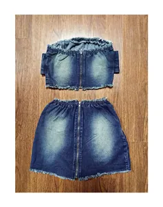 Detailed view of the blue denim tube top and matching frayed hem mini skirt set.