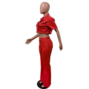 Detailed side view of a vibrant red short sleeve denim crop top and flared pants set