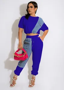 Detail of two-piece blue and denim patchwork casual set for women