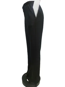 Side view of black plus size wide leg trousers featuring a comfortable elastic waist