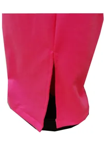 Detailed view of the side slit hem on vibrant pink plus size wide-leg trousers