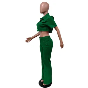Side view of vibrant green two-piece denim set with cropped jacket and flared pants
