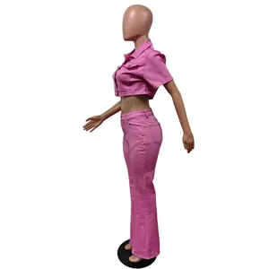 Detailed side view of pink short-sleeve denim crop jacket and flared pants set