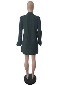 Back view detail of a black mini shirt dress with elegant flared ruffled sleeves.