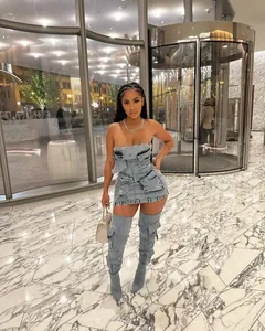 Fashionable strapless denim dress featuring multiple 3D pockets and distressed details