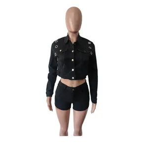 Front view of a slim fit black denim set featuring eyelet crop jacket and shorts