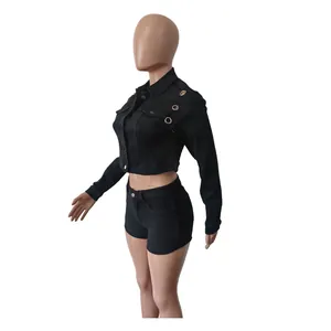 Side view of a black long-sleeve cropped denim jacket and shorts set on a mannequin