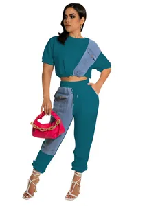 Stylish two-piece teal knit and denim patchwork casual set with crop top and joggers