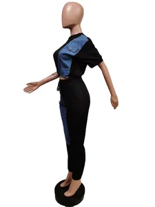Side view detail of a two-piece black and blue denim patchwork casual set on mannequin.