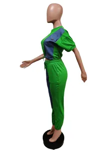 Side view of a green and blue color-blocked casual two-piece set shown on a mannequin