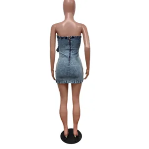 Back view of a slim fit strapless denim mini dress with a zipper on a mannequin.