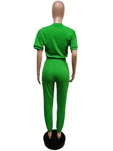 Back view of a vibrant green short sleeve t-shirt and jogger pants sports set