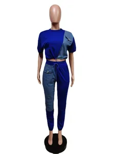 Blue two-piece leisure sports set with denim patchwork details on mannequin