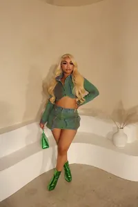 Two-piece denim set with unique green spray-paint finish and metallic boots styling