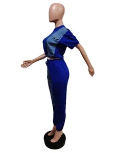 Detailed side view of royal blue and denim patchwork two-piece crop top and joggers set