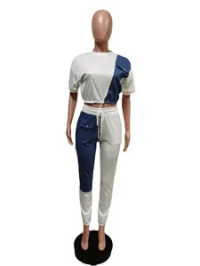 Front view of white and blue denim patchwork two-piece leisure tracksuit on mannequin