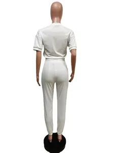 Back view of white two-piece casual lounge set with short sleeve top and joggers