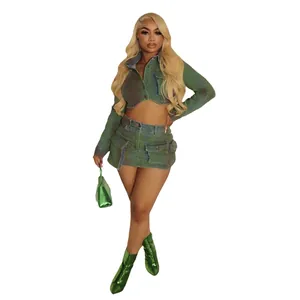 Full body view of a women's green spray-painted denim jacket and mini skirt set.