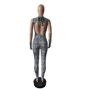Back view of trendy leopard print halter jumpsuit featuring open back and matching gloves
