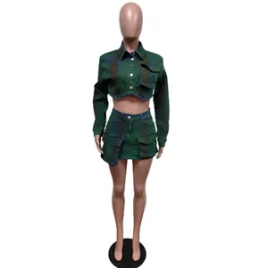 Full view of the two-piece green spray-painted stretch denim cropped jacket and mini skirt set.