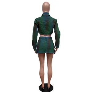 Rear view of fashionable spray-painted green denim crop jacket and mini skirt two-piece set