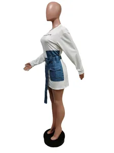 Side detail of denim corset waistband on white long sleeve dress with pocket