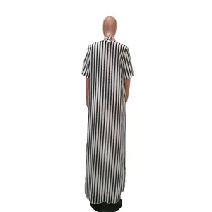 Back view of a long black and white vertical striped beach cover-up on a mannequin