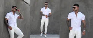 Vue détaillée d'une chemise blanche à manches courtes ajustée pour homme sur mur gris