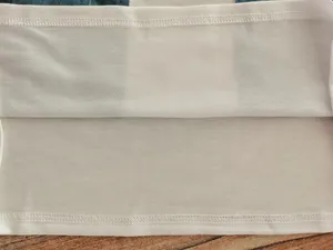 Close-up detail showing the high-quality stitching and hemline on white fabric lining