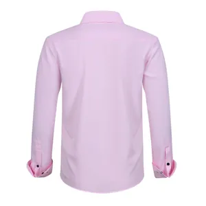 Rear view detail of a light pink men's long-sleeve stretch dress shirt with buttoned cuffs