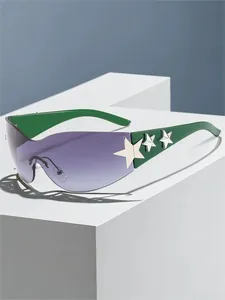 Close-up view of stylish green rimless sunglasses with silver star accents and purple lenses.