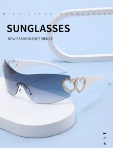 Detail of rimless Y2K sunglasses featuring elegant hollow heart metal accents on temples.